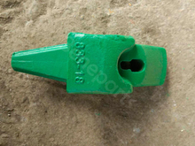 A máquina escavadora de Esco parte o adaptador 833-18 dos dentes