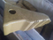 Dente de balde Caterpillar J550 1386552